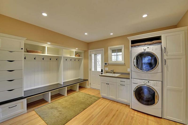 Laundry room with multiple storage spaces